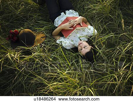 Woman sleeping in grass. View Large Photo Image Picture - Woman sleeping in grass.. Fotosearch