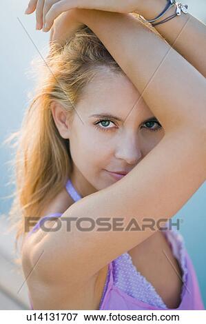 Stock Photo - Portrait of a young woman.. Fotosearch