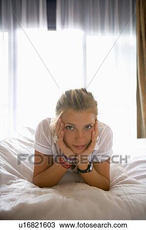Teen girl portrait on bed. View Large Photo Image Stock Image - Teen girl portrait on bed.. Fotosearch