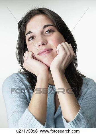 Stock Photograph - Woman resting head on hands.. Fotosearch