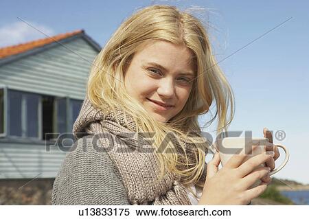 Stock Photography - Young Woman drinking Coffee or Tea. . Fotosearch