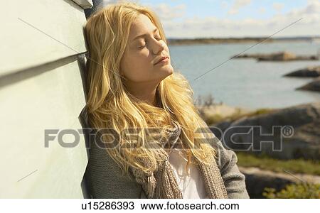Stock Image - Young Woman Relaxing.. Fotosearch