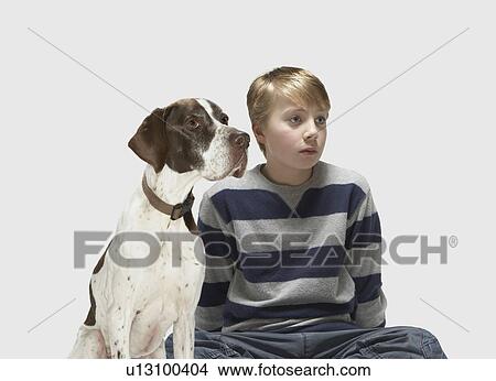 Boy and Pointer looking to the side View Large Photo Image Picture - Boy and Pointer looking to the side. Fotosearch