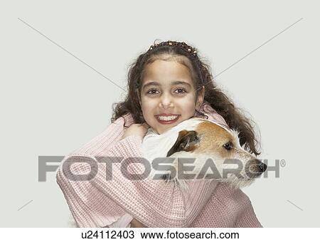 Girl holding terrier View Large Photo Image Stock Image - Girl holding terrier. Fotosearch