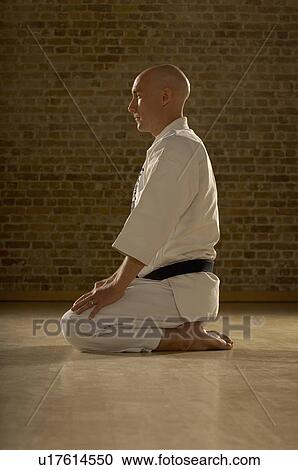 Karate man kneeling. View Large Photo Image Stock Image - Karate man kneeling.. Fotosearch