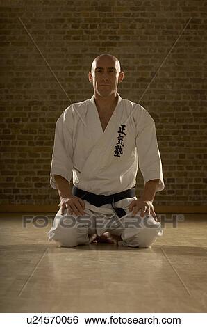Karate man kneeling. View Large Photo Image Stock Photograph - Karate man kneeling.. Fotosearch