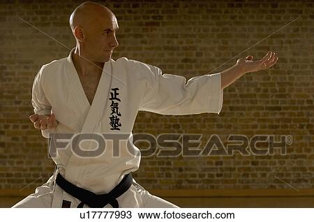 Karate man standing. View Large Photo Image Stock Image - Karate man standing.. Fotosearch