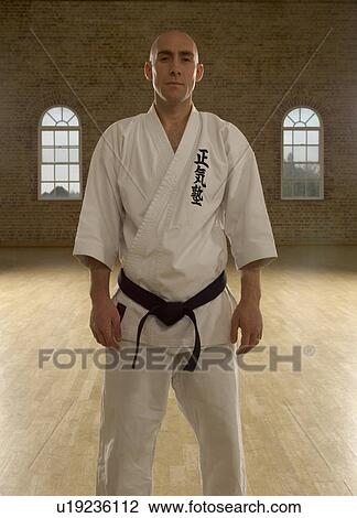 Karate man standing. View Large Photo Image Stock Image - Karate man standing.. Fotosearch