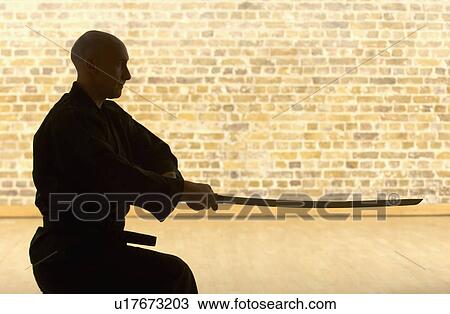 Karate man with Samurai sword. View Large Photo Image Stock Image - Karate man with Samurai sword.. Fotosearch