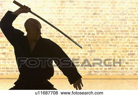 Karate man with Samurai sword. View Large Photo Image Stock Photo - Karate man with Samurai sword.. Fotosearch