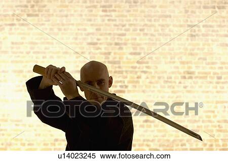 Karate man with Samurai sword. View Large Photo Image Stock Photography - Karate man with Samurai sword.. Fotosearch