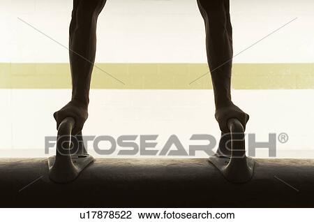 Male gymnast balancing upside down on pommel horse View Large Photo Image Stock Image - Male gymnast balancing upside down on pommel horse. Fotosearch