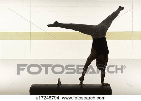 Male gymnast performing on pommel horse View Large Photo Image Picture - Male gymnast performing on pommel horse. Fotosearch