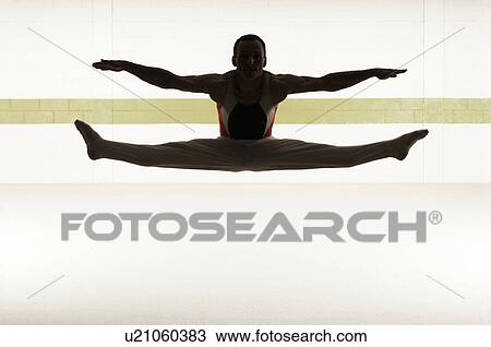 Male gymnast performing splits in floor exercise View Large Photo Image Stock Image - Male gymnast performing splits in floor exercise. Fotosearch