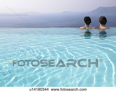 Couple in swimming pool View Large Photo Image Picture - Couple in swimming pool. Fotosearch