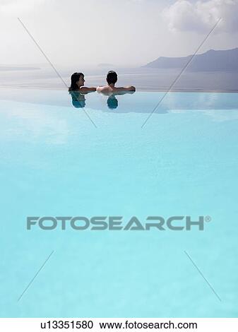 Couple in swimming pool View Large Photo Image Stock Image - Couple in swimming pool. Fotosearch