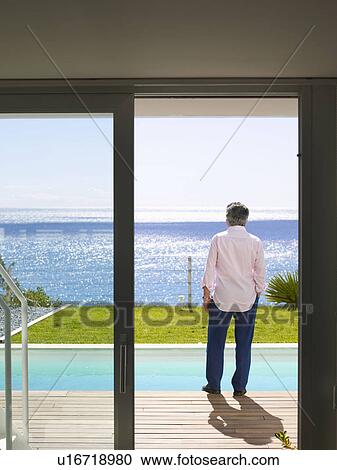 Mature man standing outdoors View Large Photo Image Stock Image - Mature man standing outdoors. Fotosearch