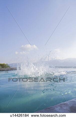 Splash in a pool View Large Photo Image Picture - Splash in a pool. Fotosearch