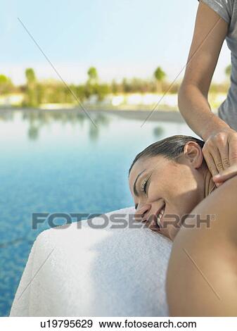Woman receiving a luxury massage View Large Photo Image Stock Photo - Woman receiving a luxury massage . Fotosearch