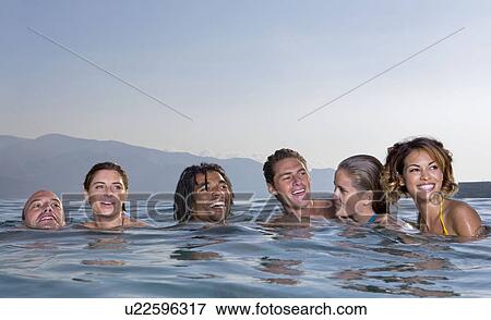 Young men and women in a pool View Large Photo Image Stock Photo - Young men and women in a pool. Fotosearch