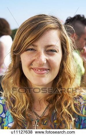 Stock Photo - Girl outdoors smiling. Fotosearch