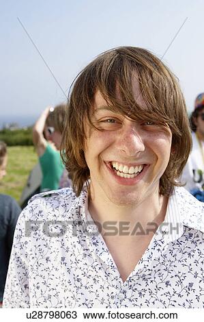 Stock Image - Man outdoors smiling. Fotosearch