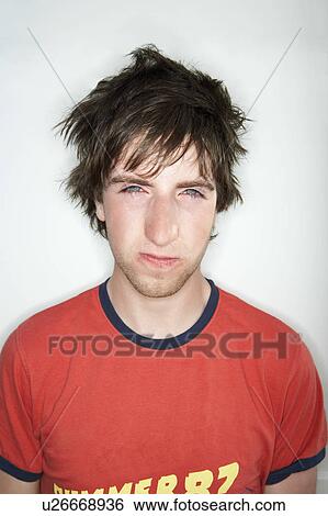 Stock Photograph - Young male looking at camera. Fotosearch