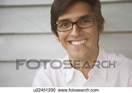 Stock Image - Young Man in white shirt.. Fotosearch