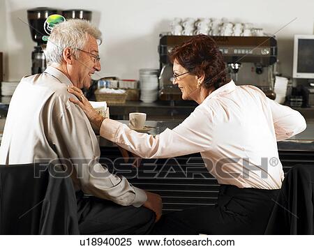 Businesspeople at a bar drinking coffee. View Large Photo Image Stock Photography - Businesspeople at a bar drinking coffee.. Fotosearch