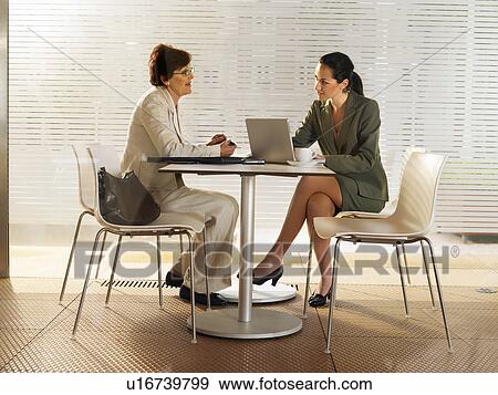 Businesswomen in a restaurant. View Large Photo Image Stock Photo - Businesswomen in a restaurant.. Fotosearch