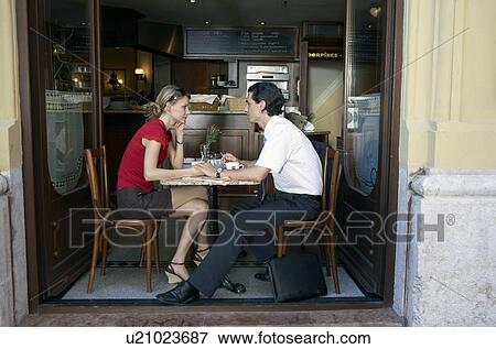 Couple at a restaurant together. View Large Photo Image Stock Photo - Couple at a restaurant together.. Fotosearch