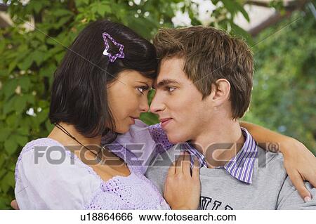 Stock Photograph - Man and woman embracing.. Fotosearch