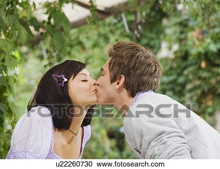 Man and woman kissing. View Large Photo Image Stock Image - Man and woman kissing.. Fotosearch
