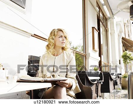Woman at an outdoor restaurant View Large Photo Image Stock Image - Woman at an outdoor restaurant. Fotosearch