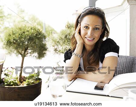 Woman at an outdoor restaurant View Large Photo Image Stock Image - Woman at an outdoor restaurant. Fotosearch