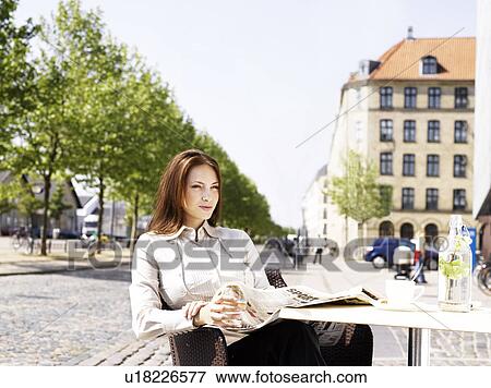 Stock Photo - Woman at an outdoor restaurant. Fotosearch