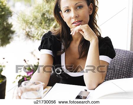 Woman at an outdoor restaurant View Large Photo Image Stock Photograph - Woman at an outdoor restaurant. Fotosearch