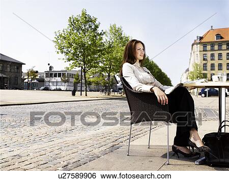 Woman at an outdoor restaurant View Large Photo Image Stock Photograph - Woman at an outdoor restaurant. Fotosearch