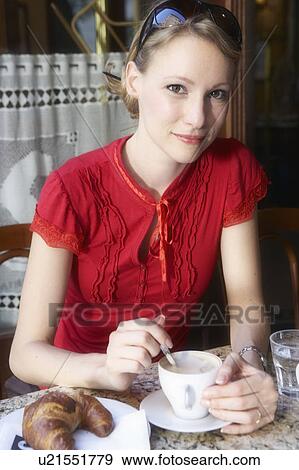 Woman having a cup of coffee. View Large Photo Image Stock Photo - Woman having a cup of coffee.. Fotosearch