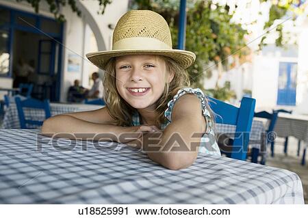 Young girl at an outdoor restaurant smiling. View Large Photo Image Stock Image - Young girl at an outdoor restaurant smiling.. Fotosearch