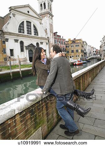 Couple embracing on parapet. Dorsoduro, Venice, Italy. View Large Photo Image Stock Image - Couple embracing on parapet. Dorsoduro, Venice, Italy.. Fotosearch