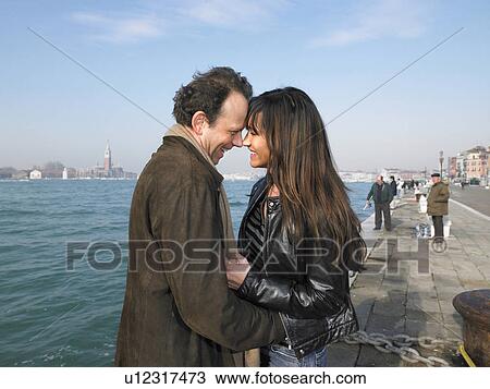 Stock Image - Couple embracing. Venice, Italy.. Fotosearch