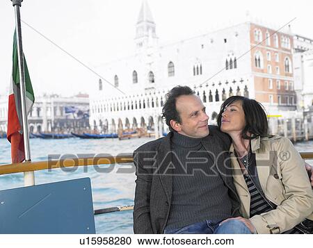 Couple on vaporetto boat near Palazzo Ducale. Venice, Italy. View Large Photo Image Stock Image - Couple on vaporetto boat near Palazzo Ducale. Venice, Italy.. Fotosearch
