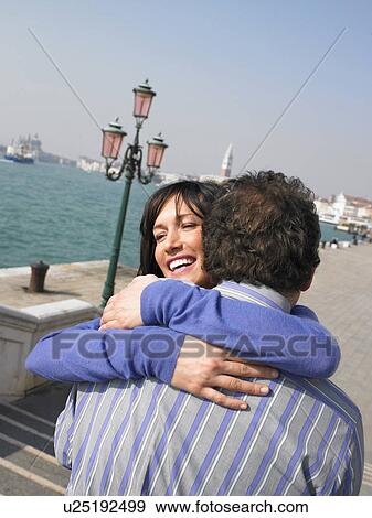 Portrait of couple hugging near lagoon. Venice, Italy. View Large Photo Image Stock Photo - Portrait of couple hugging near lagoon. Venice, Italy.. Fotosearch