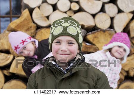Stock Photo - Children posing with winter hats on. Fotosearch