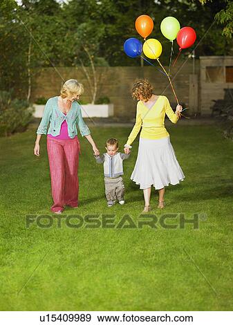 Grandmother, mom and son holding hands View Large Photo Image Stock Photo - Grandmother, mom and son holding hands. Fotosearch