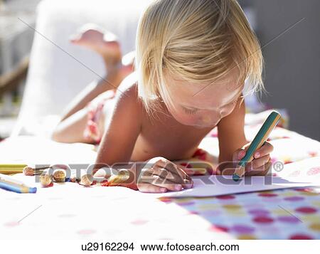 Little girl drawing a picture in the sun View Large Photo Image Picture - Little girl drawing a picture in the sun. Fotosearch