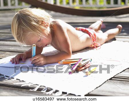 Little girl drawing a picture in the sun View Large Photo Image Stock Photo - Little girl drawing a picture in the sun. Fotosearch