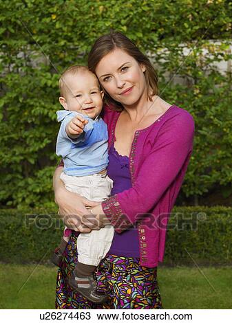 Stock Image - Portrait of mother and baby. Fotosearch