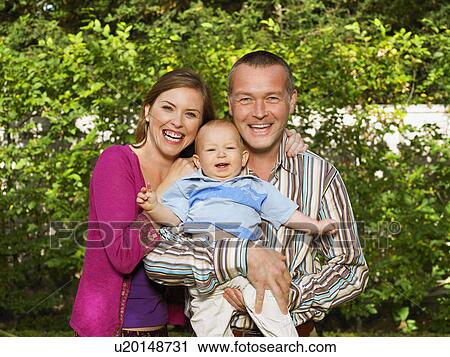 Portrait of mother, father and baby View Large Photo Image Stock Image - Portrait of mother, father and baby. Fotosearch